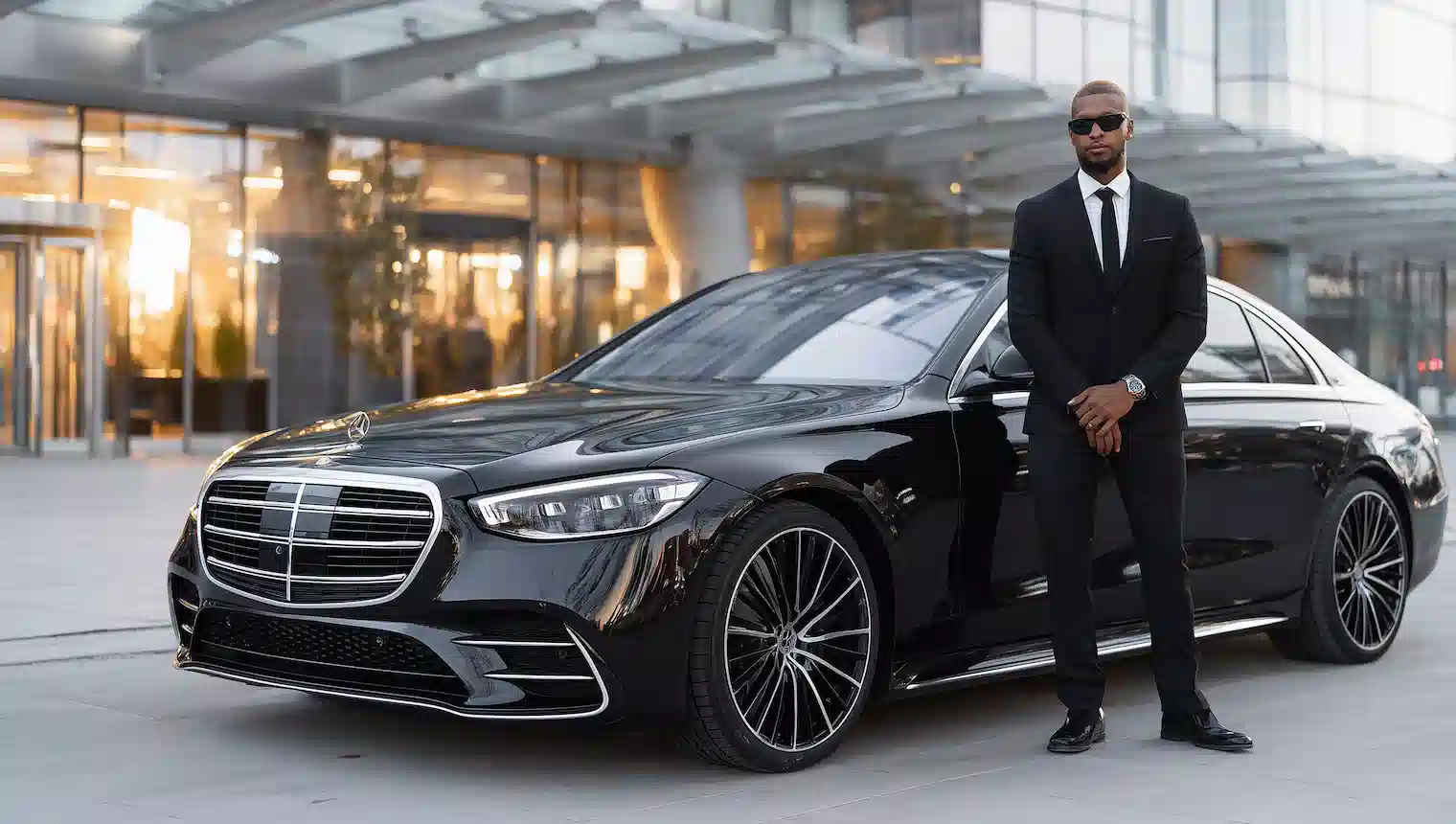 Professional chauffeur greeting a client for car service in Naperville, IL